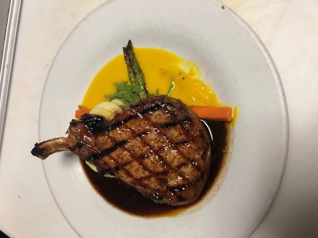 Grilled pork chop with New Mexican green chile glaze - vacation chef menu